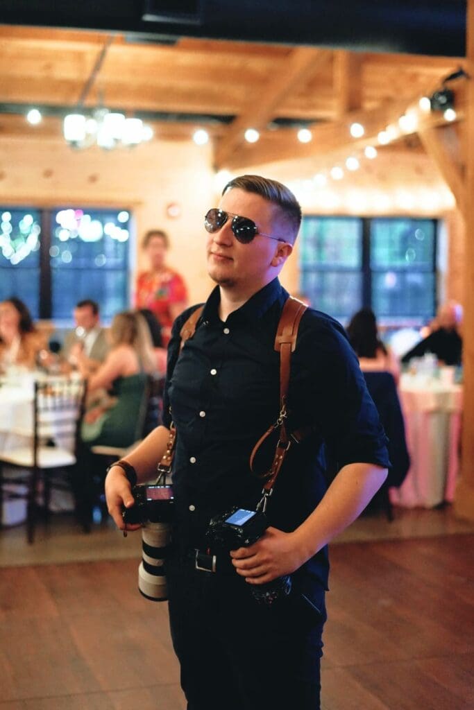 Wedding Photographer Poses For A Photo
