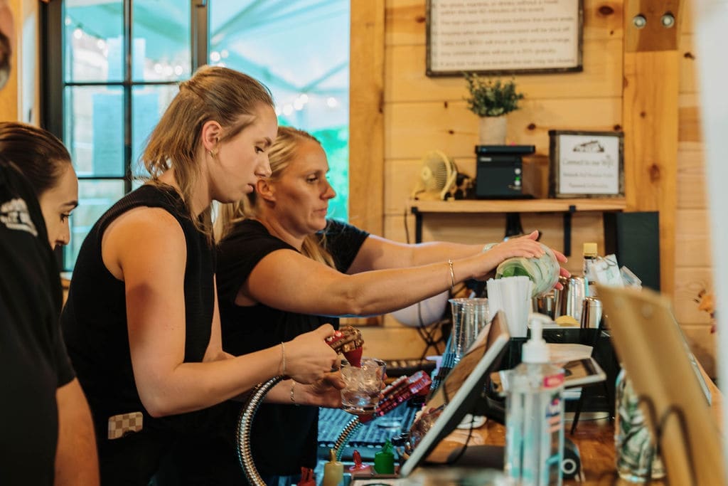 Wedding Vendors In The Bar At A Reception