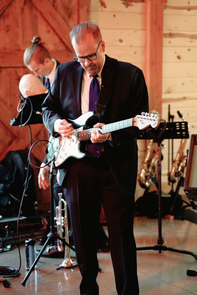 Wedding Guitarist In An Indoor Reception