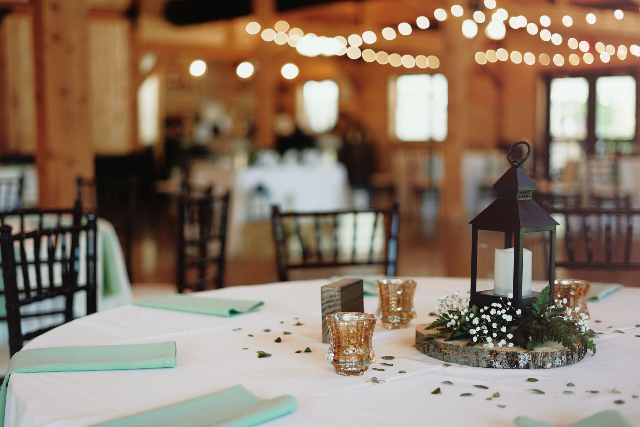 Pastel Green and White Table Decor for Indoor Wedding Reception