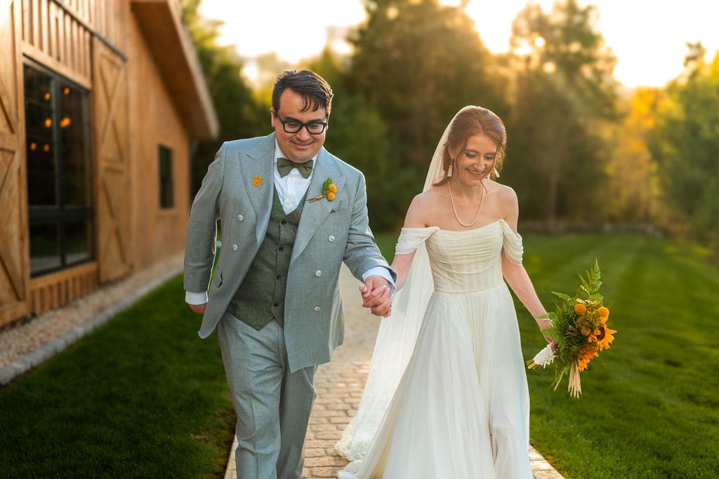 Couple Portrait Walking at their Wedding Venue, Barn at Bull Meadow 