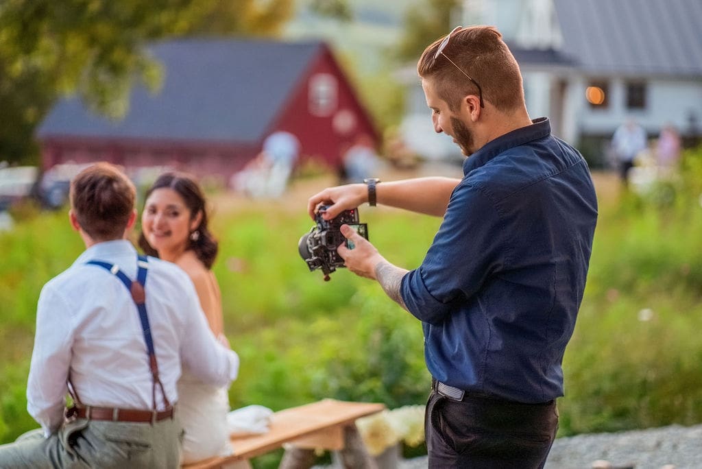 Wedding Photographer taking a photo of bride and groom